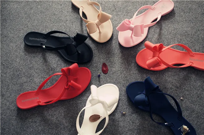 

Summer New Pin Bow Knot Cool Slippers Female Beach Shoes Pure Color Human Word Drag Fruit Frozen Shoes Wholesale