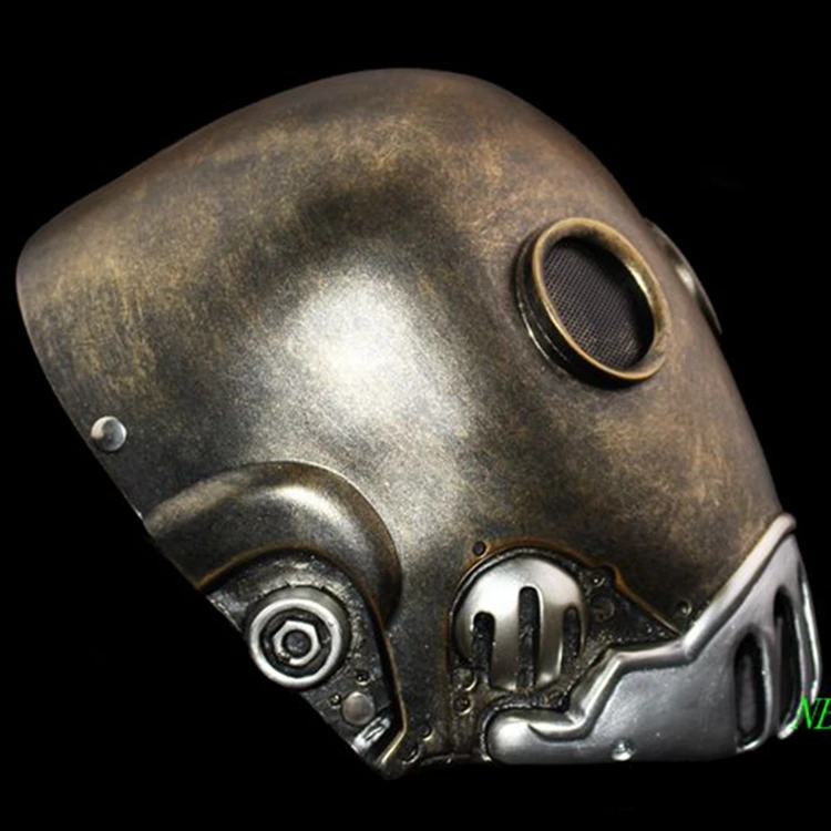 metallilise välimusega hõbedane ja pronksjas mask, millel on ümarad detailid ja võrgusilmad