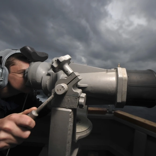Seaman looks through the ship__s big eyes aboard USS Truxtun Poster Print (17 x 11)