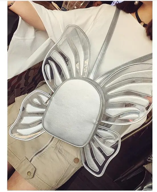 

Fashion creative Butterfly Wings Small Bags student Schoolbag Lady Backpack Hollow Paint Laser Package Solid Fashion Mini bag