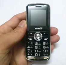 La más barata función de Mini teléfono antorcha larga espera MP3 Bluetooth GSM 900/1800MHZ 0.3MP tarjeta SIM Dual ruso idioma teclado(China)