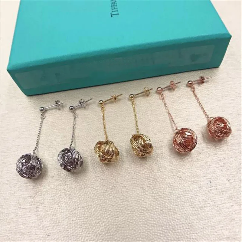 

TIFF 925 Sterling Silver Stud Earrings with a cutout shape. Whole body sterling silver fashion three colors optional ladies gift