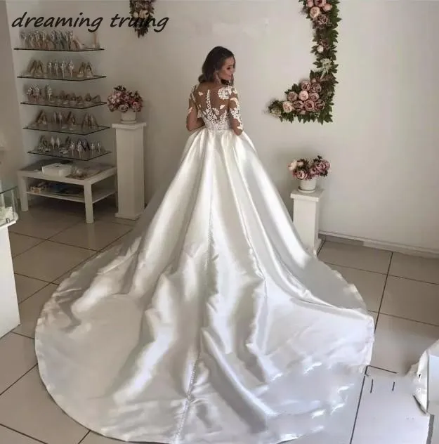 conew_2018-newest-white-ivory-bridal-wedding-dresses-vintage-sheer-long-sleeves-appliques-cathedral-long-train-bridal-gowns_conew1