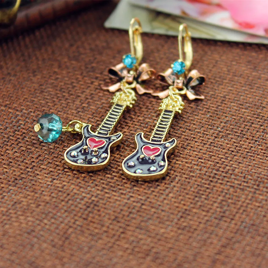 

Fashion stud earrings 2014 Fashion new pure and fresh quietly elegant and contracted combination guitar lady's ear clip 140515
