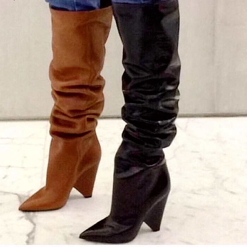 woman in black leather thigh high boots