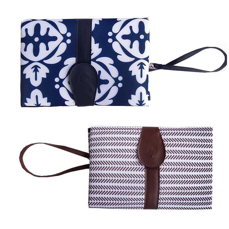 diaper changing pad with barrier