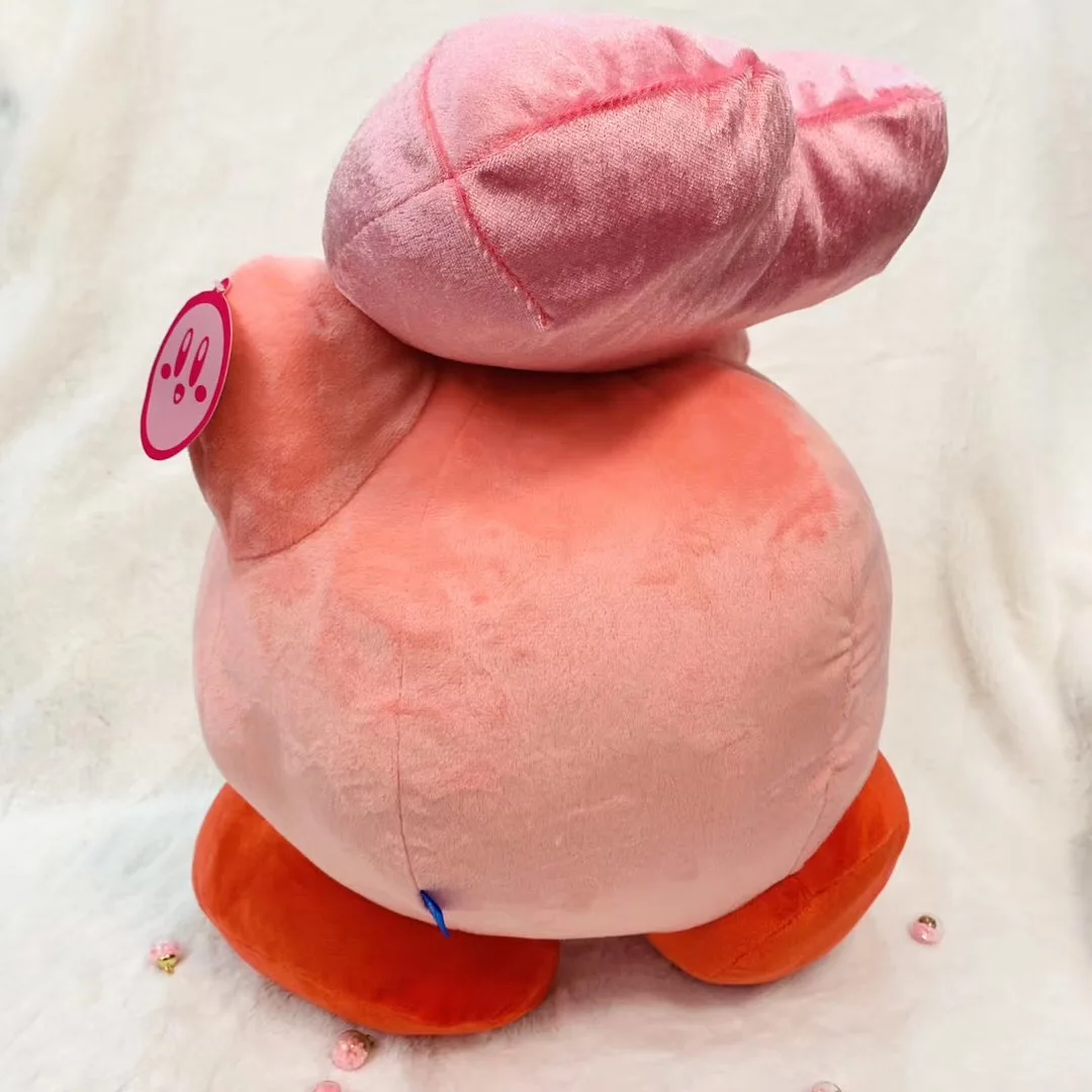 kirby holding heart plush