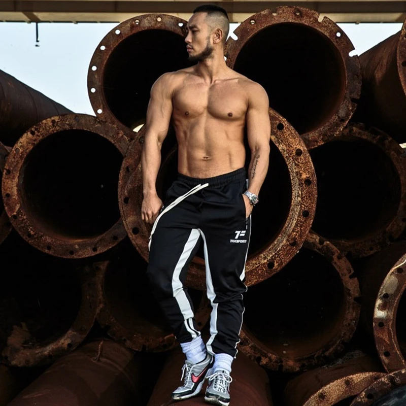 

2019 spring and summer new casual fitness jogging pants men's cotton slim twill cotton pants fashion pants men's brand clothing