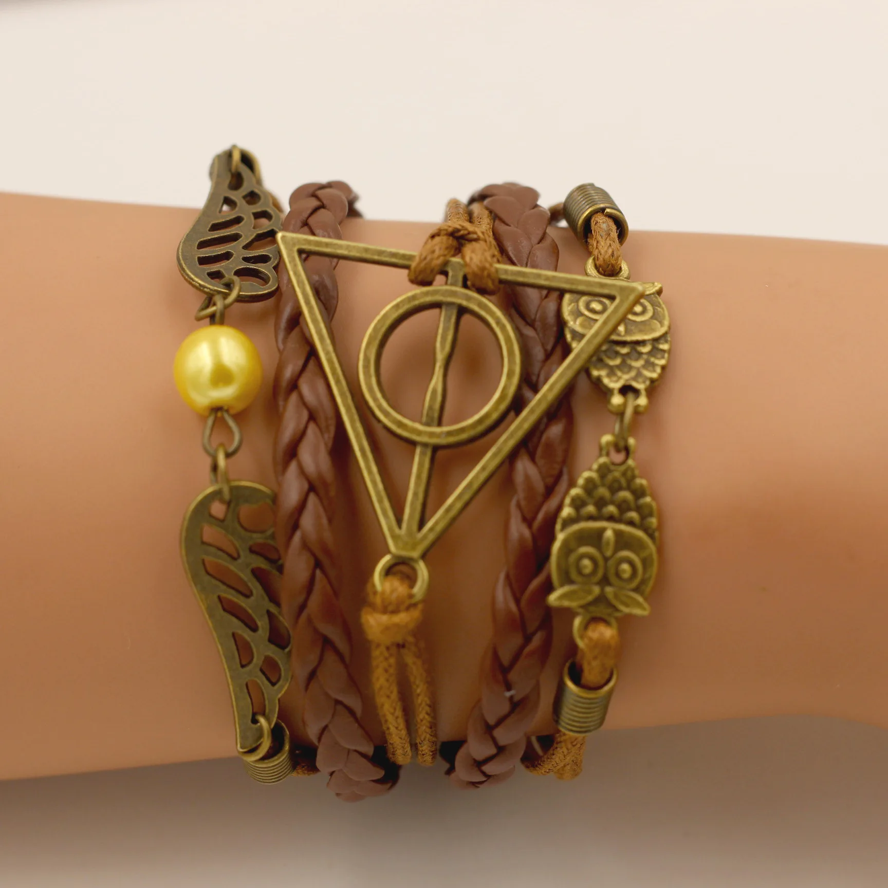 

Anime Harry Death Hallows Potter Action Figure Retro Leather Cord Bracelet Golden Snitch Wings Owl Triangle Multilayer Bracelet