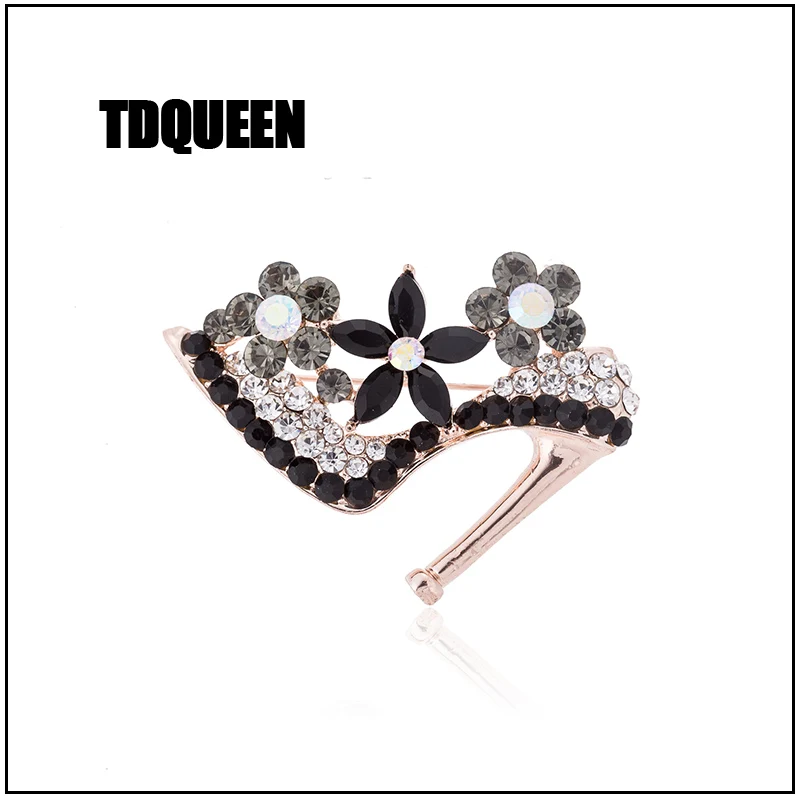 black heels with brooch