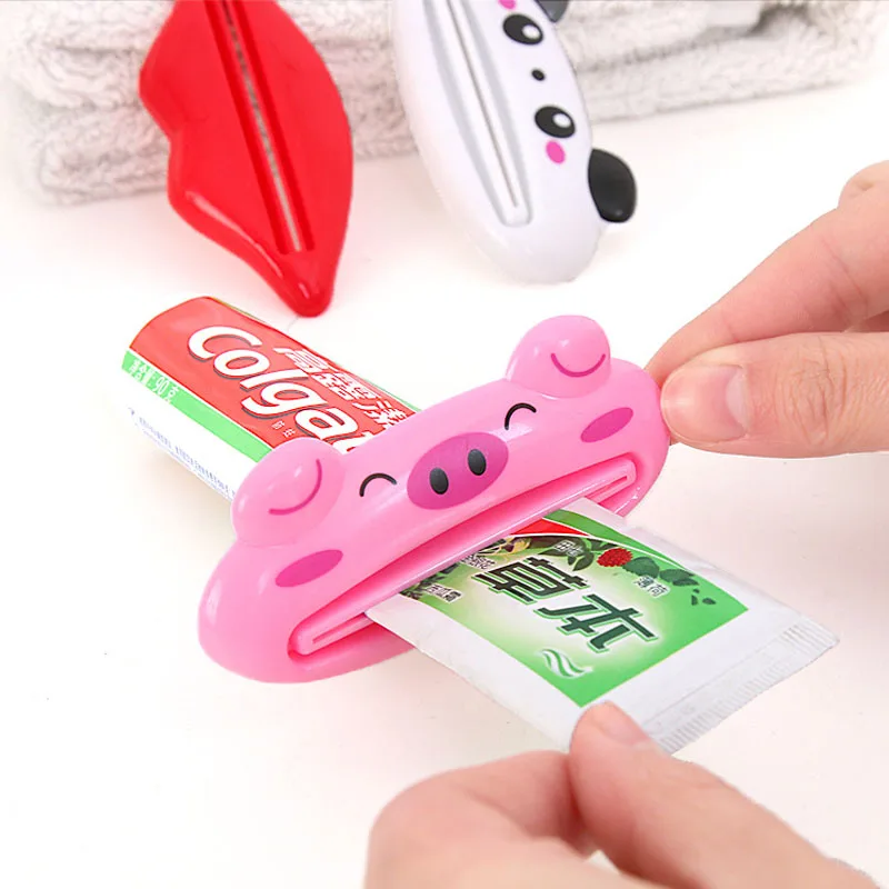 HOT Bathroom Home Tube Rolling Holder Squeezer Easy Cartoon Toothpaste Dispenser 