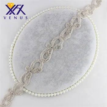 

XINFANGXIU Wholesale bowknot Rhinestone applique trimming, can cut into many small crystal bowknot appliques for clothing .