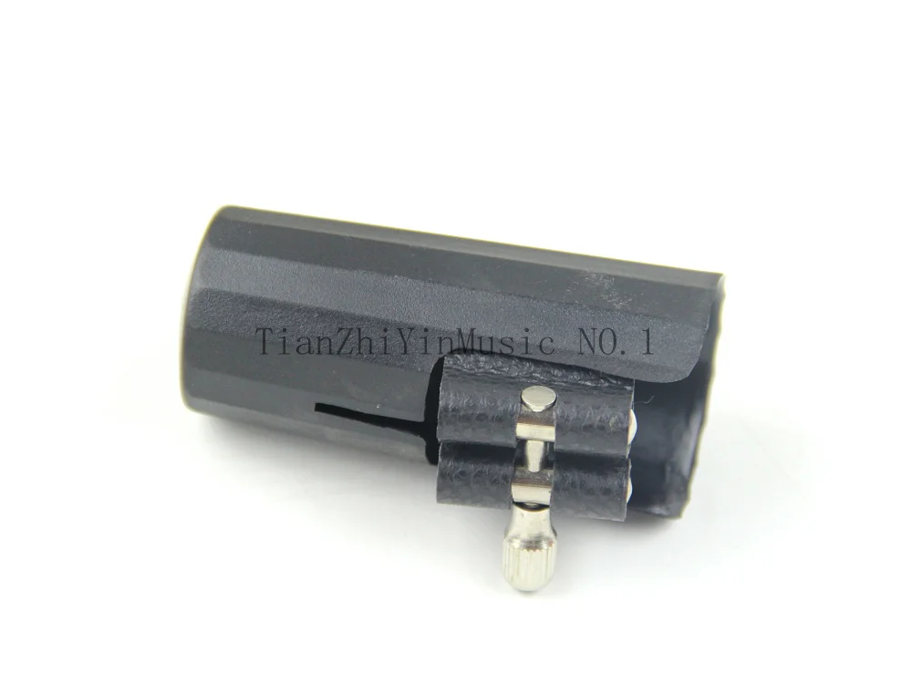 

Ligature and cap for clarinet and Alto Sax parts