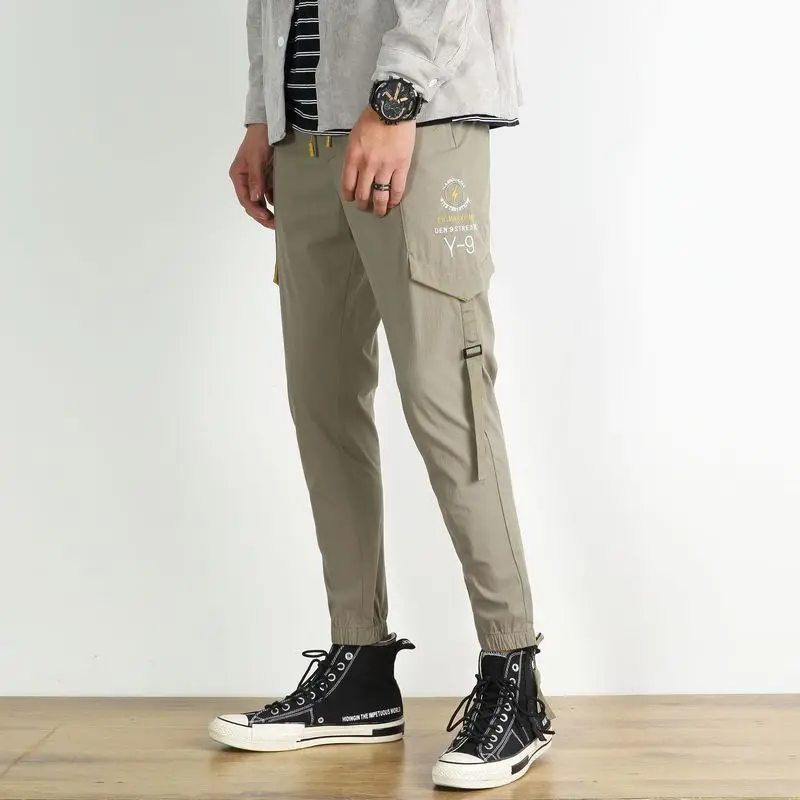 

Spring and summer men's casual pants elastic beam foot overalls thin section sports nine pants men's casual tide brand pants