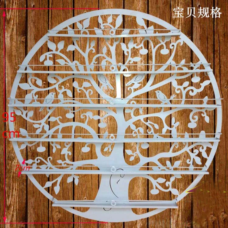 Hang a wall, wrought iron nail polish carrying shelves. Nail salons display shelf