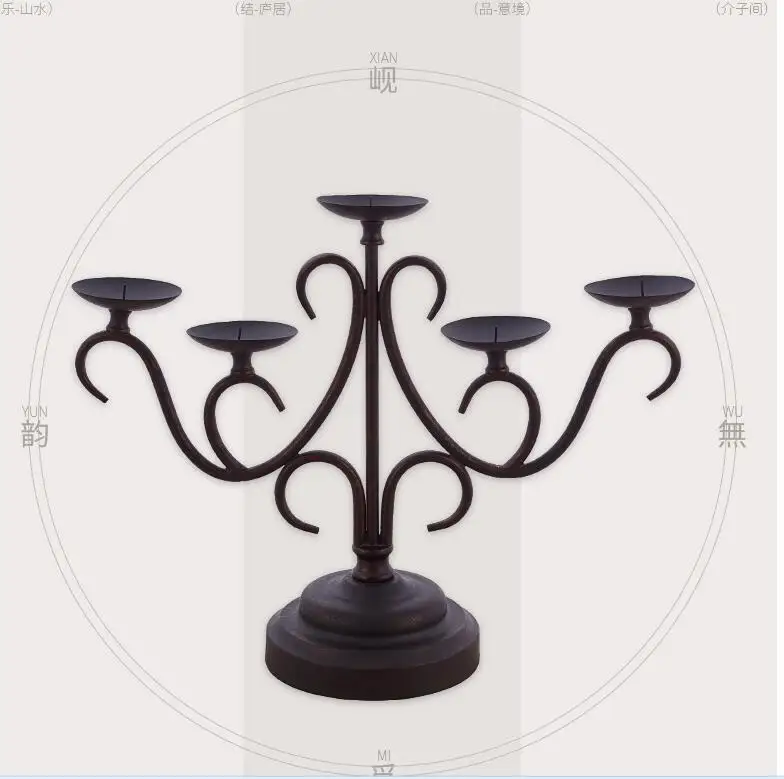 

Vintage antique iron art candlestick with a simple modern Chinese style living room table decoration.