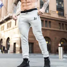 Новые мужские хлопчатобумажные спортивные брюки мужские тренажеры фитнес, бодибилдинг, тренировка брюки повседневные модные брюки Мужские Jogger узкие брюки