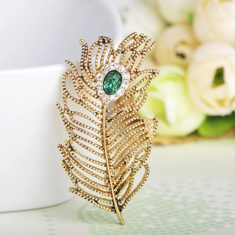 

Blucome Fashion Sea Green Crystal Leaves Feather Shape Brooches Clip Lady Suit Coat Lapel Pin Hats Banquet Dress Vintage Corsage