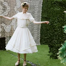 LYNETTE’S CHINOISERIE Spring summer all-match tassel beige expansion bottom bow fashion vintage medium-long bust skirt