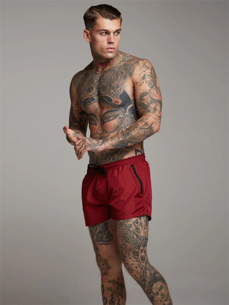 Muscleguys летние однотонные Бодибилдинг компрессия быстросохнущие шорты мужские спортивные тренажеры фитнес мужские шорты обтягивающая одежда - Цвет: Красный