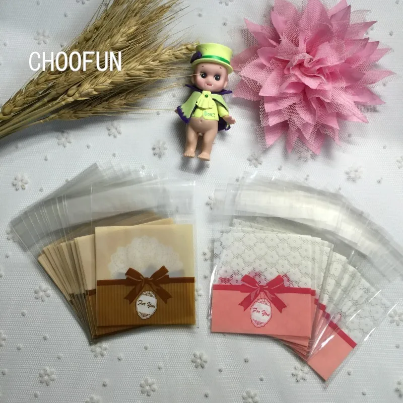 

100pcs 7*7+3cm 2 Colors Bow Self adhesive opp Cookie Baking Plastic Bags Wedding Decoration Gift Candy Packaging Bags BZ223