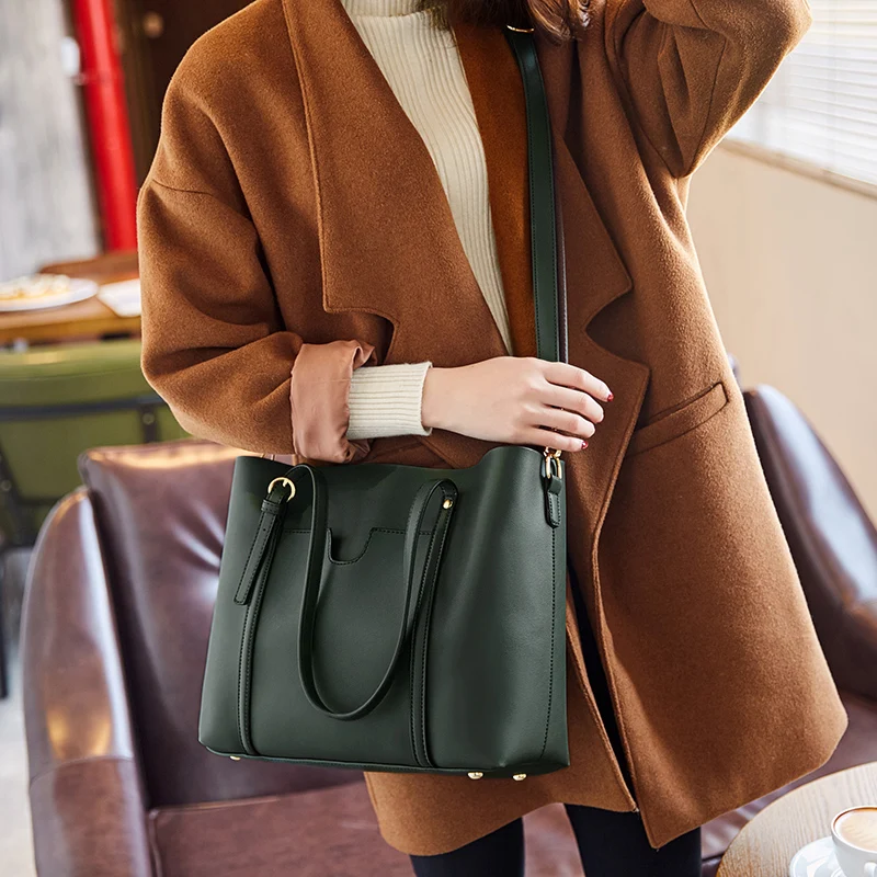Simple and beautiful Genuine Leather duffle bag New belt decoration women handbags Fashion wild spring and summer shopping bags