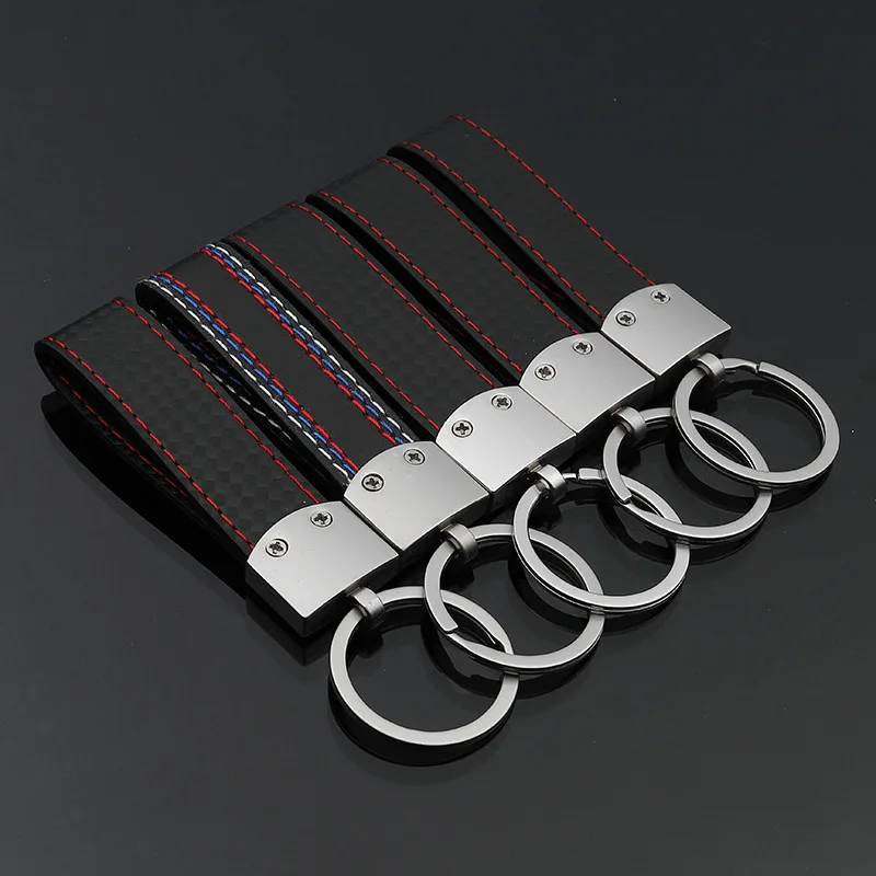 

Carbon Fiber Belt Leather Car Logo Keychain Auto Emblem Keyring For AUDI BENZ Vehicle Key Chain Ring Fob Promotion Gift CNYOWO