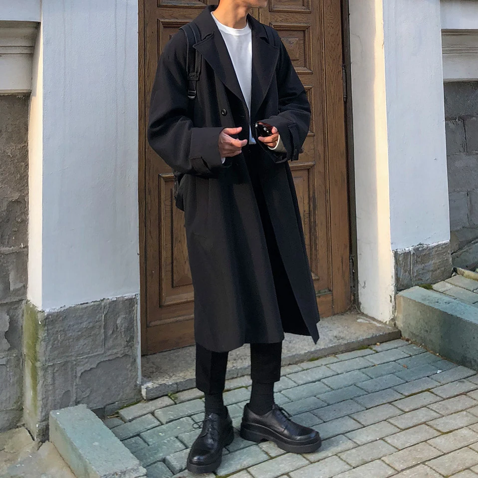 

Fall new style of shoulder-down windbreaker men's long knee-length Korean version of coat trend handsome boys loose coat men's.