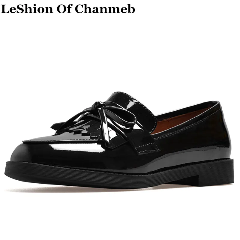 black flats with tassels