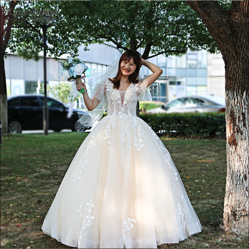

Deep V-Neck Gorgeous Wedding Princess Ball Gowns Beaded Pearls Many Layers Tulle Light Champagne Bridal Noivas DW144