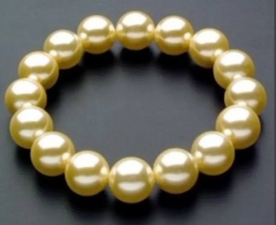 

FREE SHIPPING HOT sell new Style >>>>Wonderful South 10mm Yellow Sea Shell Pearl Bracelet AAA 7.5