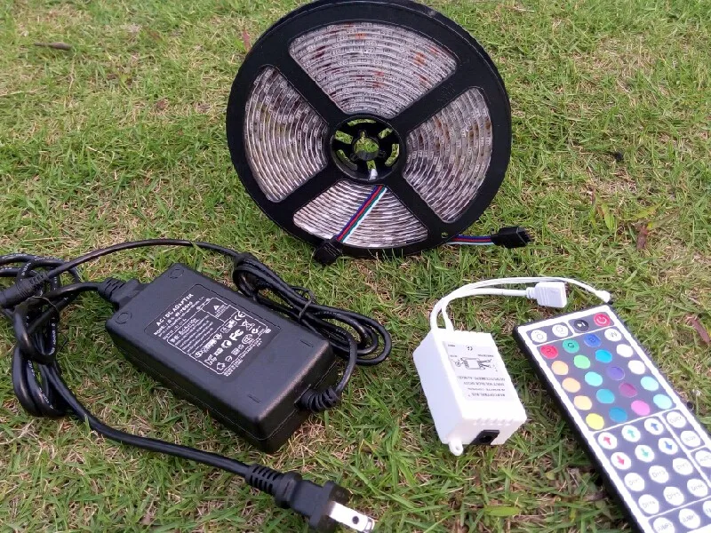 

5050 60leds/m RGB LED Strip 5m IP65 Waterproof Tape Multicolor + 44 Keys Remote Controller +AC 110V 220V Power Adapter EU US UK