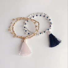 Дизайн два цвета растягивается нежный элегантный браслет с кисточками