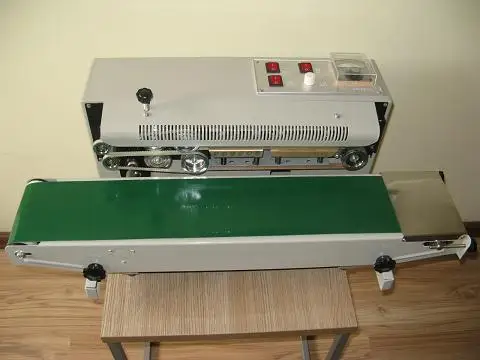 

Guaranteed 100% New 220V Automatic Continuous Plastic Bag Sealing Machine,Heating Packing Machine for food FR-900