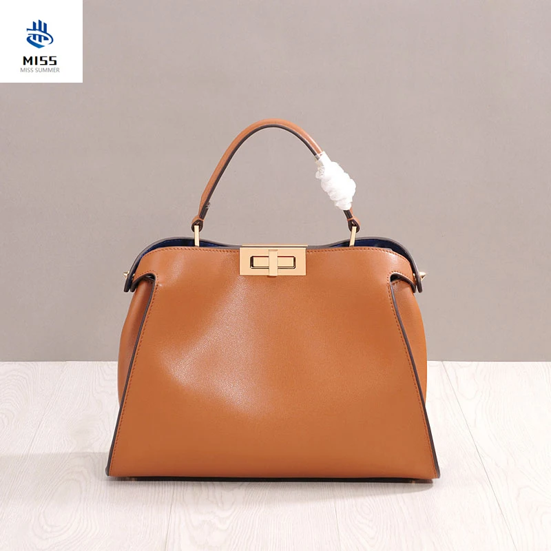 

2019 new cow leather handbag Rotating buckle large kitten bag Unique design women's bag Crossbody bag shoulder bag