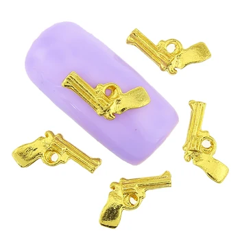 

Top Nail 10 Pcs/Lot Gun Design Gold Alloy Metal Studs Supplies For Charms Nails Diy Glitter 3D Nail Art Decorations TN1796