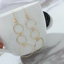 Серьги с кисточками геометрической формы асимметричные круглые