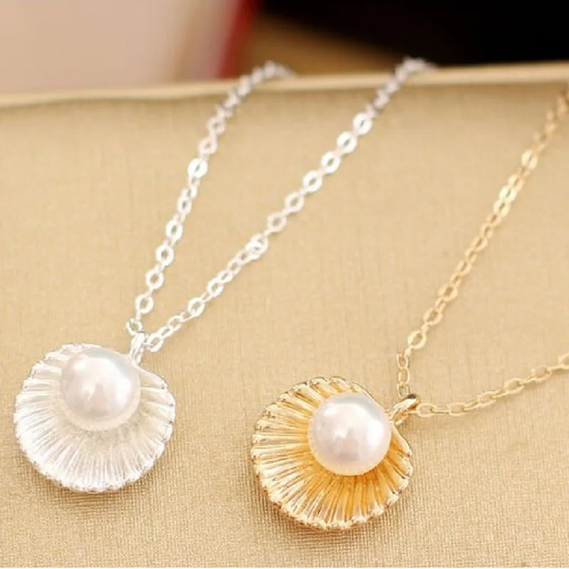 подвеска ракушка. кулон зеленая жемчужина 750. кулон с жемчугом в ракушке. подвеска с жемчугом из ракушки. кулон с жемчугом в ракушке.