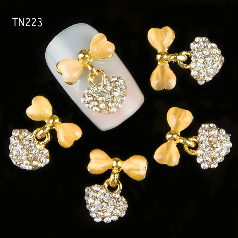 

10Pcs/Lot 3D Gold Alloy Bow With Love Heart Pendant Charms Nails Studs Glitter Rhinestones Decorations For Strass Nail Art TN223