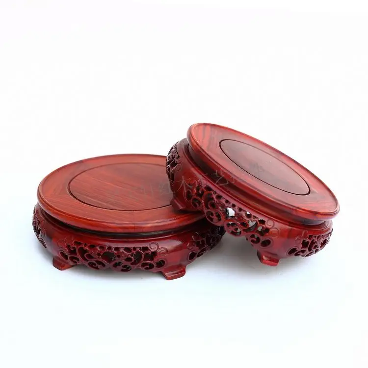 Red wingceltis of solid wood carving round base household act the role ofing is tasted annatto handicraft furnishing articles