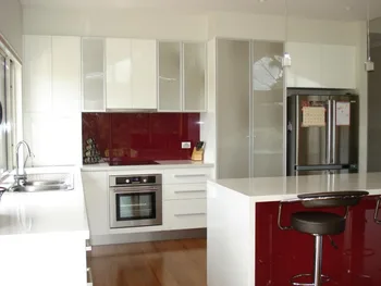 

Modern kitchen furniture with red kitchen backsplash