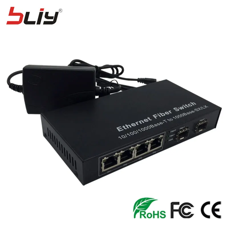 2 sfp slot fiber optical gigabit switch sfp to 4 rj45 UTP ports ethernet media converter SC single mode FTTH GPON terminal 2 sfp slot fiber optical gigabit switch sfp to 4 rj45 UTP ports ethernet media converter SC single mode FTTH GPON terminal