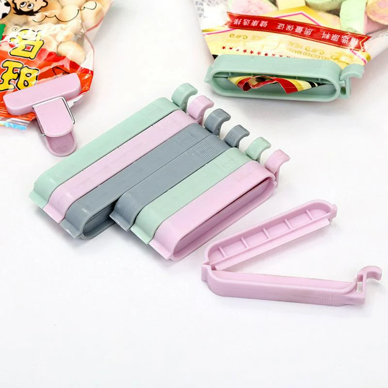 

New 12Pcs/Lot Creative Reusable Plastic Home Food Bag Clips Convenient Portable Mini Seal Stick Storage Sealing Food Clips Hot