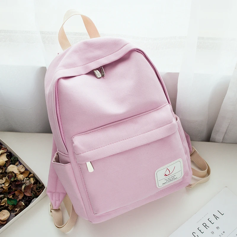 

Simple solid color canvas shoulder bag female Korean version of the small fresh backpack leisure school wind bag