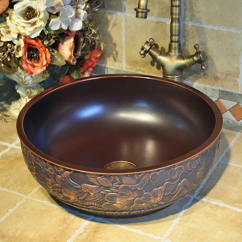 China Artistic Handmade Ceramic Bathroom Sinks Lavobo Round Countertop elegant wash basin brown carving bird pattern (4)