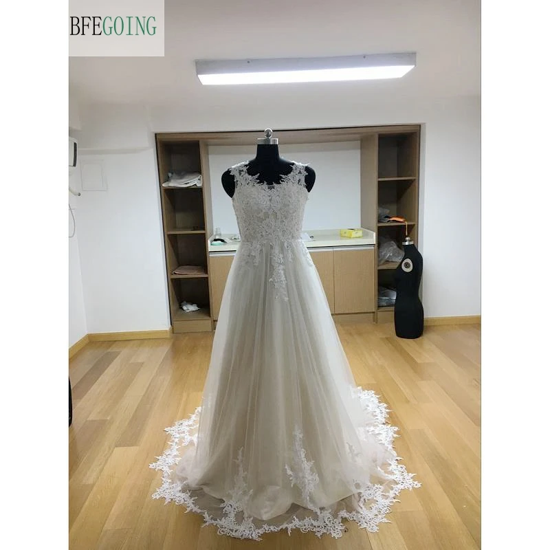 

Ivory Tulle V-Neck Floor-Length A-line Wedding dresses Chapel Train Sleeveless Bridal Gown Custom made