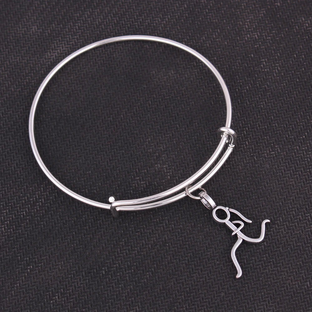 

Running girl and Ice skates Charms adjustable bracelet