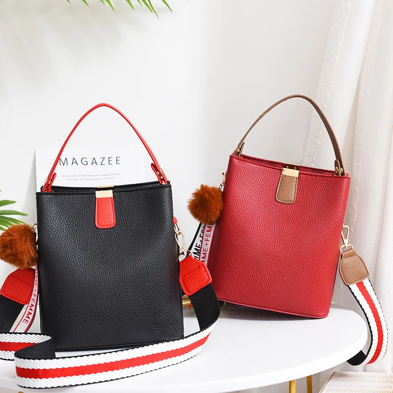 

Hot Korean version of the bucket bags wide shoulder strap single shoulder bags oblique bags portable bags female bags