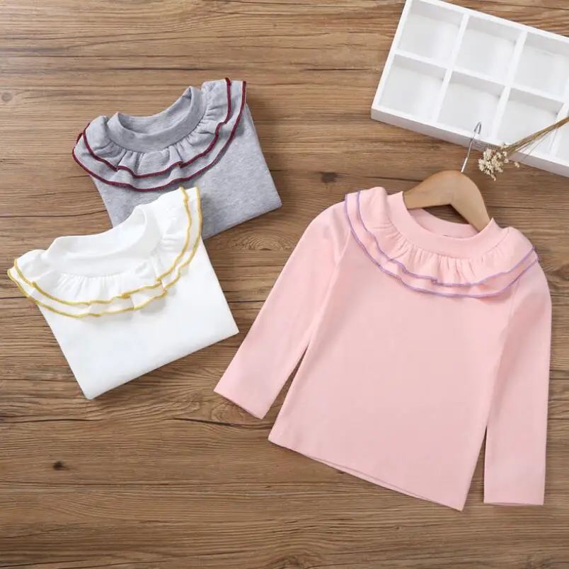 

new style children's long sleeved T-shirt girl, Korean version Pure color long sleeves long sleeved cotton T-shirt sweater.
