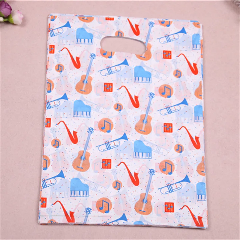 

Новый дизайн, оптовая продажа, 100 шт./лот, 25 х35 см, модные пластиковые сумки для покупок с гитарой, подарок на день рождения, Zakjes